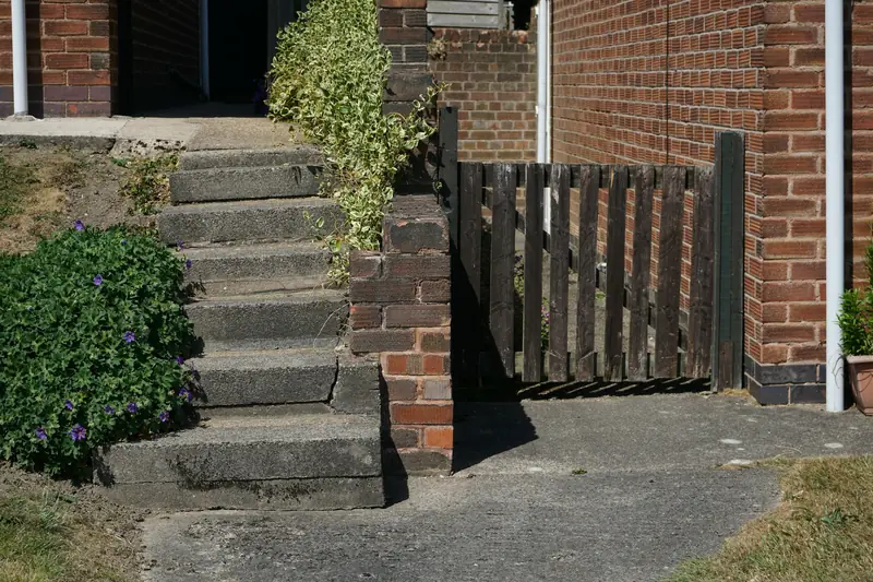 Brick steps, retaining wall and garden gate