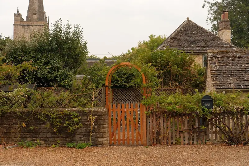 Timber gate in a stone garden wall