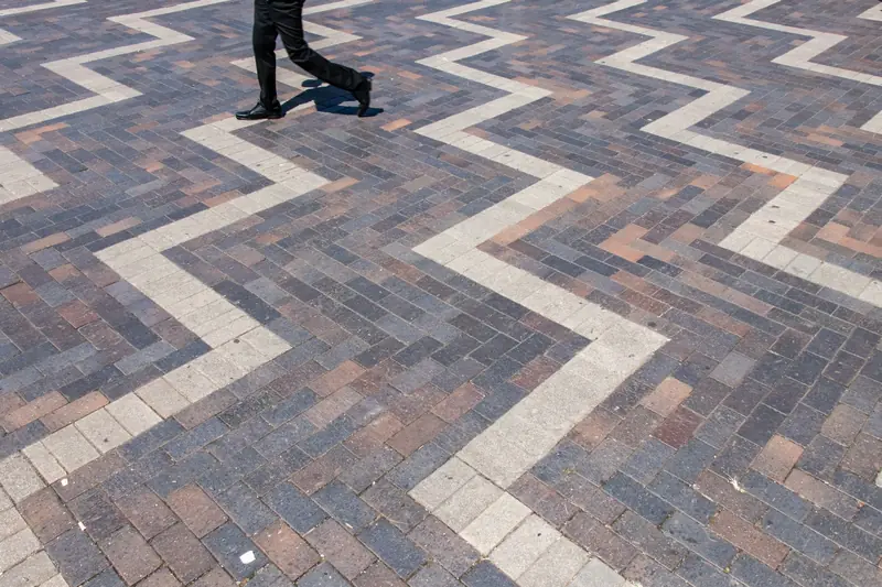 Herringbone block paving with a contrasting border course
