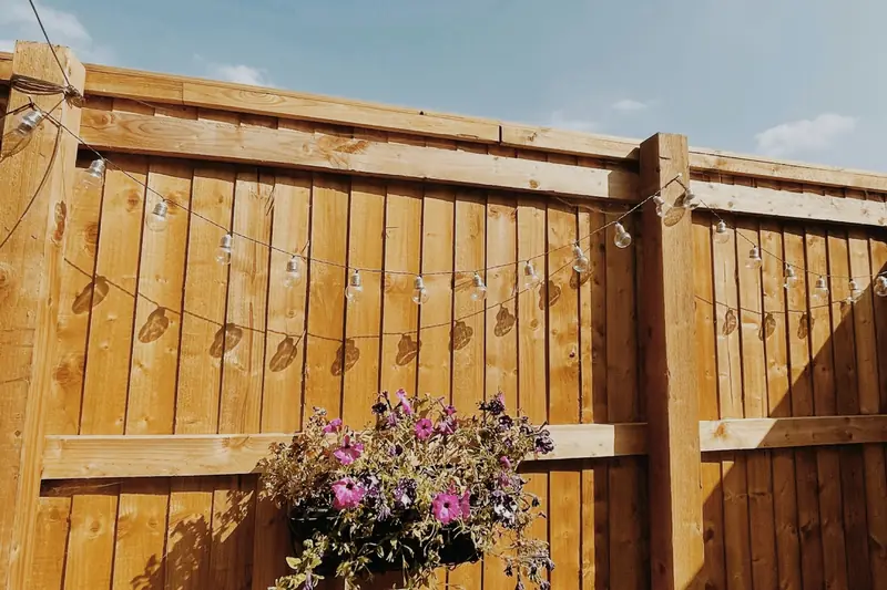 Timber fence with hanging basket