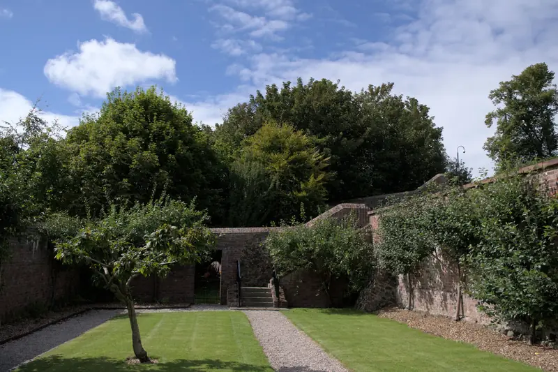 Walled garden with lawn